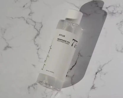 Close-up bottle of Anua Heartleaf 77% Soothing Toner showing label details