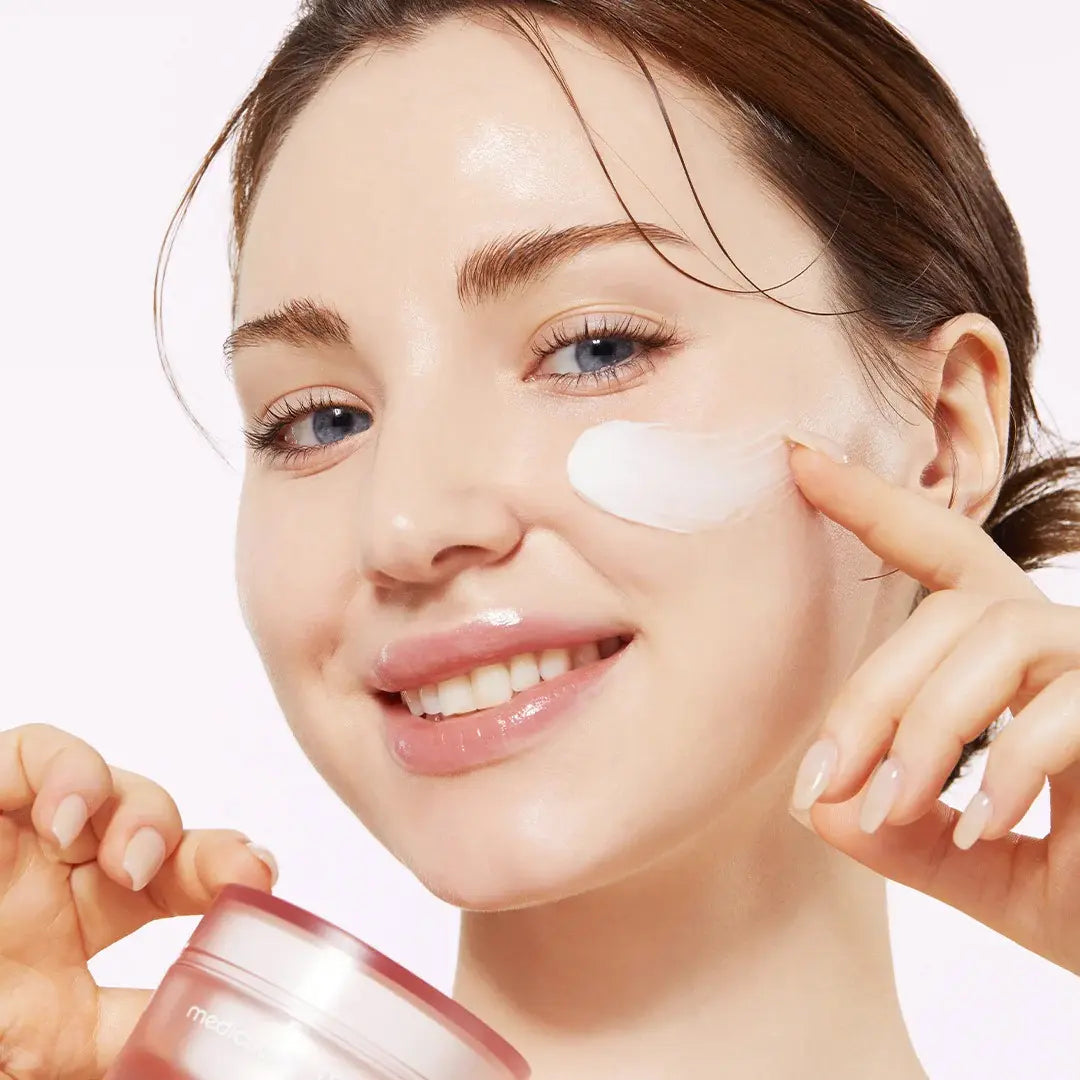 Model applying Medicube Triple Collagen Cream | firming, brightening